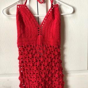 Red homemade dress made of yarn